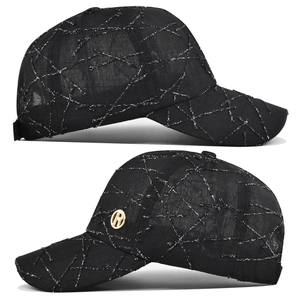 Detail view of black baseball cap with silver stitching and gold metal R logo plate