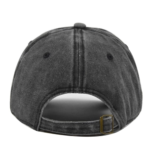 Close-up of charcoal gray washed cotton baseball cap with adjustable bronze metal buckle