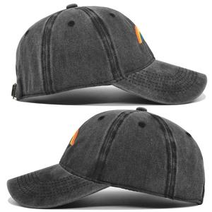 Detail of washed dark grey denim baseball cap featuring rainbow embroidery and metal buckle