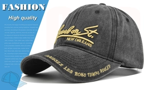 Close-up of 3D embroidery and washed fabric texture on a vintage baseball cap