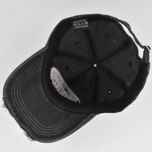 Detail of internal cotton stitching and adjustable metal buckle on vintage baseball cap