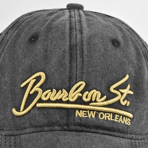 Deep grey washed baseball cap with premium 3D gold embroidery text detail