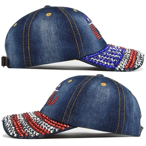 Detail of blue denim baseball cap featuring red white and blue rhinestone elephant pattern