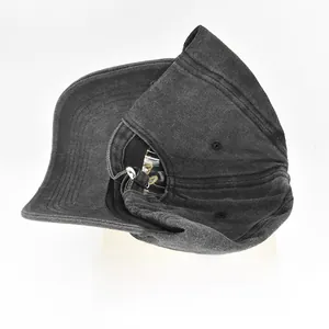 Detailed view of black washed denim baseball cap weighing 89.9g on digital scale