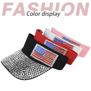 Detail view of baseball caps in four colors featuring rhinestone US flag and brim studs