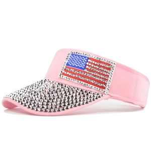 Detail of light pink baseball cap with sparkling rhinestones and American flag pattern