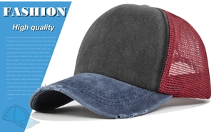 Detailed view of vintage washed baseball cap with distressed brim and red mesh back