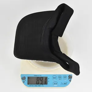 Detail showing a rhinestone baseball cap on a digital scale weighing 89.1g