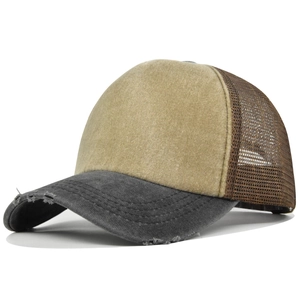 Detail view of distressed baseball cap with khaki canvas front and brown mesh back panels