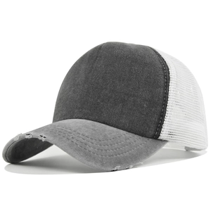 Detail of grey washed cotton trucker hat with white mesh back and distressed brim design