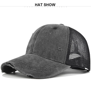 Close-up of distressed grey baseball cap with breathable black mesh and ripped vintage details