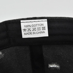 Macro view of 100% cotton material tag and stitching inside the vintage baseball cap