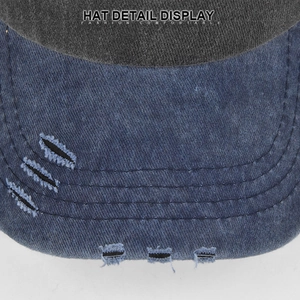 Detail of washed denim baseball cap featuring distressed ripped visor and neat stitching