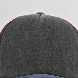 Detail of multi-color washed cotton baseball cap with gray, blue and red stitched panels