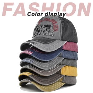 Vertical stack of vintage washed baseball caps showing multi-color embroidery details