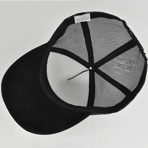 Detailed interior of mesh trucker hat showing cotton lining and breathable fabric seams