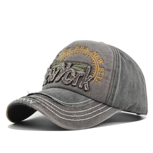 Detail of vintage smoke grey washed cotton baseball cap with 3D New York embroidery
