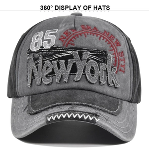 Macro detail of New York 3D embroidery on vintage washed grey canvas baseball cap