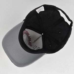 Macro shot of the interior cotton fabric, embroidery details, and care label on baseball cap