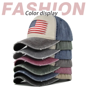 Vertical stack of vintage American flag baseball caps in various colors and distressed fabrics