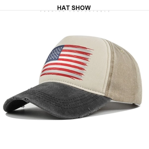 Close-up of distressed US flag print on a vintage trucker hat with mesh back