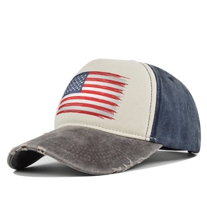 Detailed view of distressed US flag print and frayed brim on vintage baseball cap