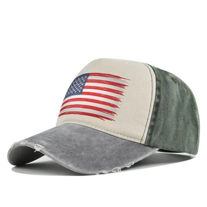 Close-up of vintage American flag print on distressed washed denim baseball trucker hat