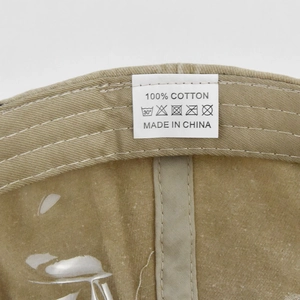 Detailed interior of vintage cotton cap showing sweatband and washing care label