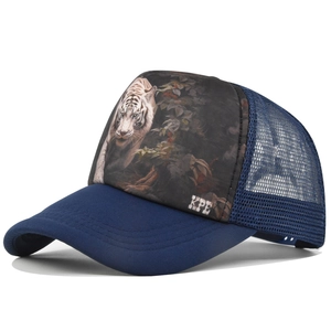 Detailed close-up of white tiger jungle print and KPE logo on navy mesh trucker hat