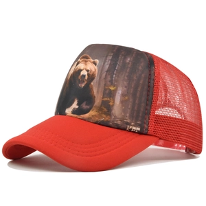 Close-up of red mesh trucker hat featuring a realistic roaring bear forest print detail
