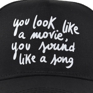 Close-up of you look like a movie print on black cotton baseball cap detail