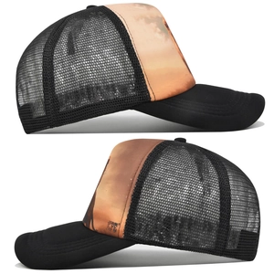 Detail view of black mesh trucker hat with sunset print from side angles