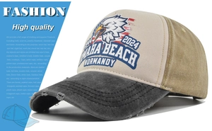 Close-up of vintage eagle print and distressed brim on the three-color trucker hat