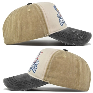 Macro side view of vintage washed canvas baseball cap with distressed brim and embroidery