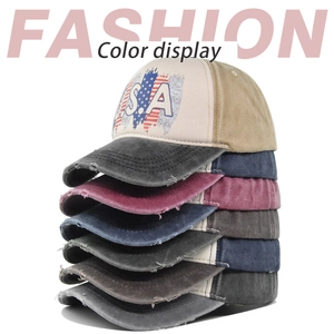Vertical stack showing multiple colors of washed vintage USA baseball caps for men