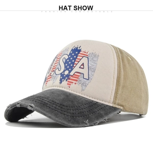 Detailed close-up of the vintage USA print and distressed brim on the baseball cap