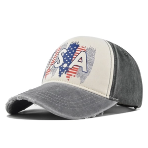 Detail view of vintage USA baseball cap with distressed brim and retro flag print