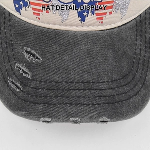 Close-up of vintage washed denim baseball cap brim with distressed holes and reinforced stitching