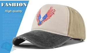 Detail of vintage eagle print on truck hat with distressed brim and stars and stripes motif