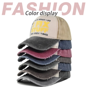 Stacked collection of distressed washed baseball caps with I FIX STUFF vintage printing