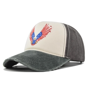Close-up of vintage trucker hat featuring distressed brim and patriotic eagle print