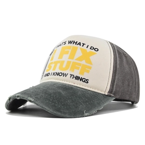Detail of retro trucker hat showing washed canvas texture and vintage slogal print
