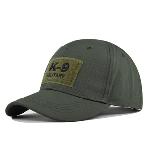 Detail view of military green tactical K-9 baseball cap showing ripstop fabric texture