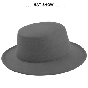 Detail view of dark grey flat top wool felt fedora with fine stitching and wide brim