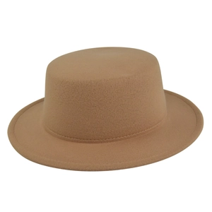 Detailed macro view of the camel wool felt texture on the flat top jazz fedora hat