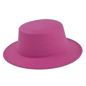 Detailed view of magenta flat top wool felt hat with precise stitching and fine texture