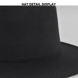 Macro detail of high-quality black wool felt hat showing precise stitching and soft texture