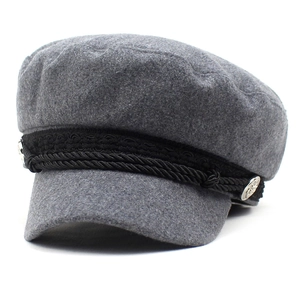 Classic gray wool newsboy cap with black rope detail and silver buttons at 45 degree angle
