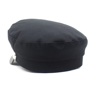Chic black baker boy hat for women with leather peak and silver side buttons detail