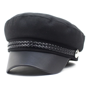Classic black wool newsboy cap with a leather brim and silver side button detail